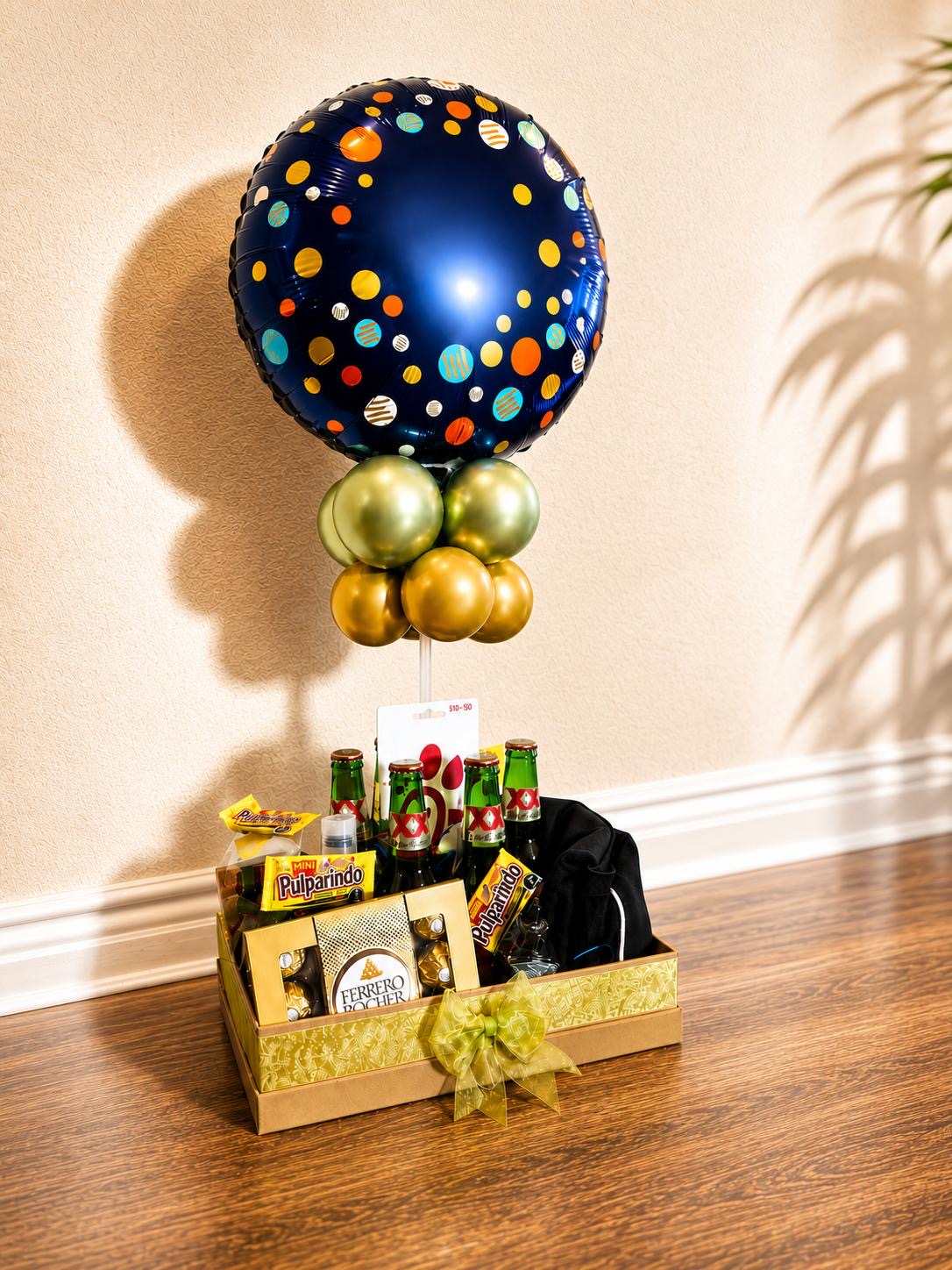 Gold gift box of chocolates and candy with a balloon topper
