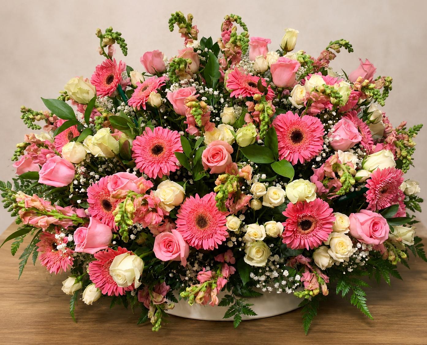 Low centerpiece of pink gerberas and roses