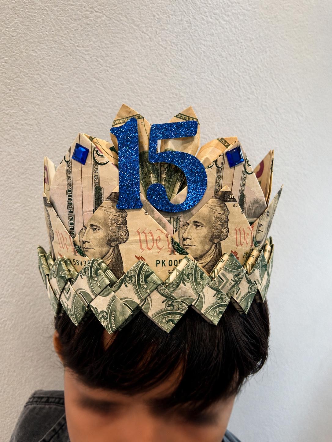 Folded money crown with a number fifteen