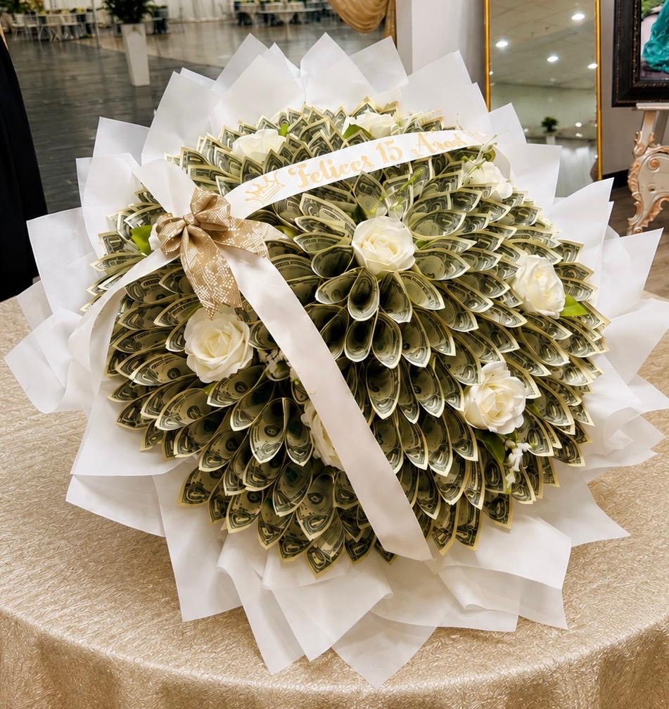 Folded money fan bouquet accented with white roses