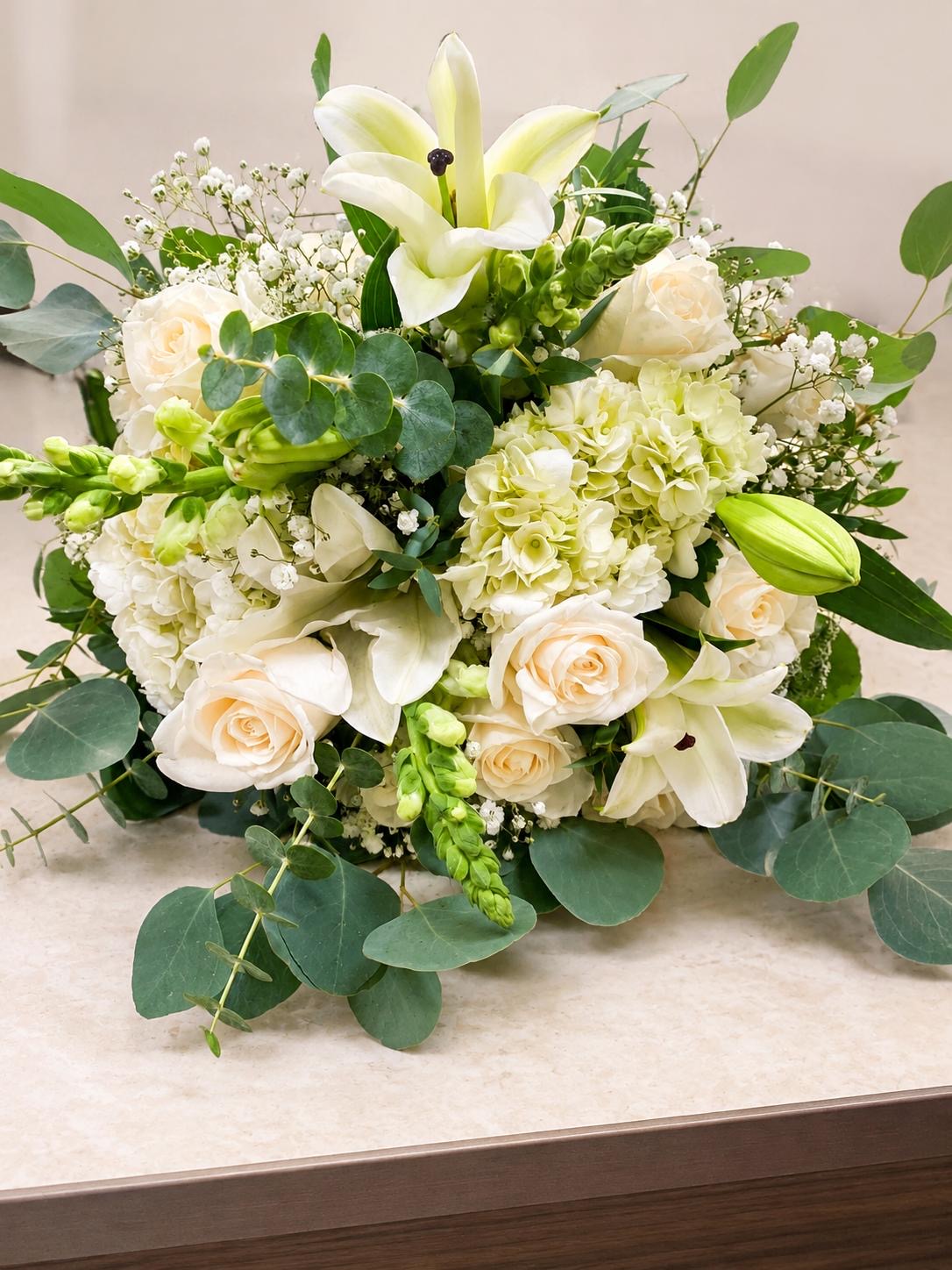 Bouquet of white lilies, roses and hydrangea